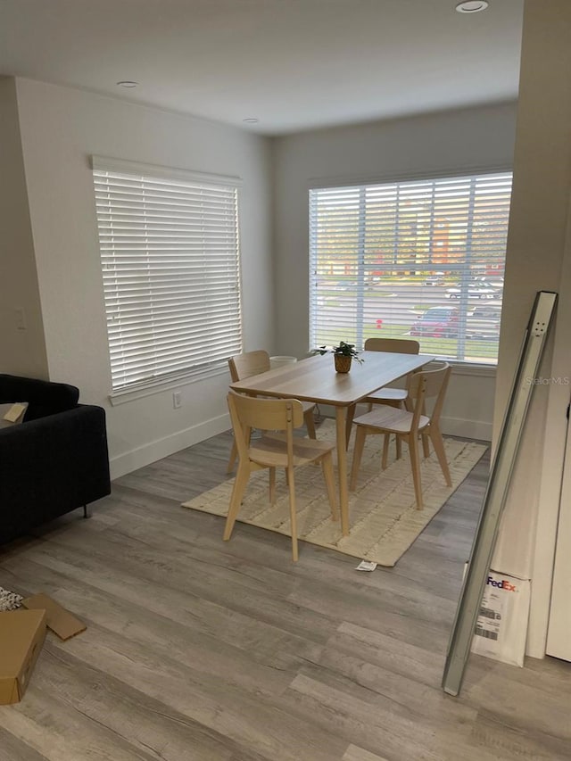 dining area with wood-type flooring