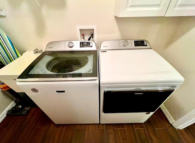 laundry area with cabinets and washer and dryer