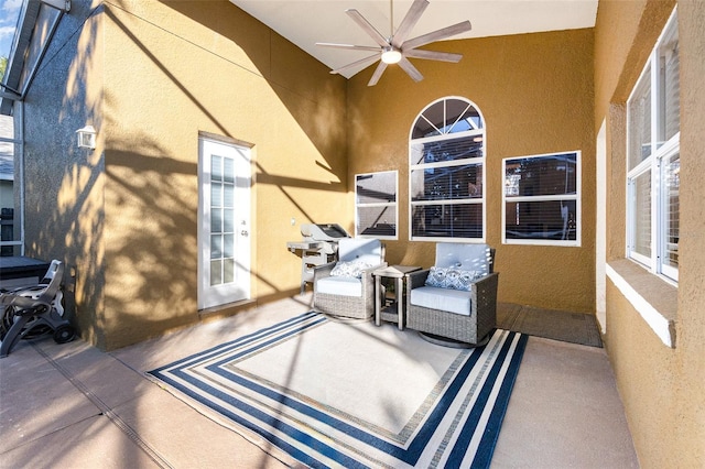 view of patio featuring area for grilling and ceiling fan