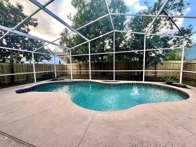 view of pool with a lanai and a patio area