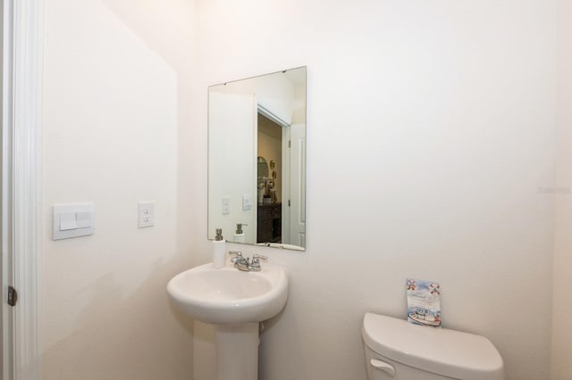 bathroom featuring toilet