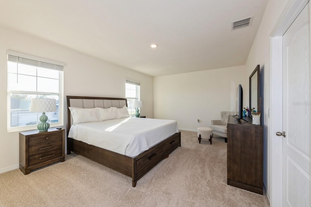 bedroom featuring light carpet