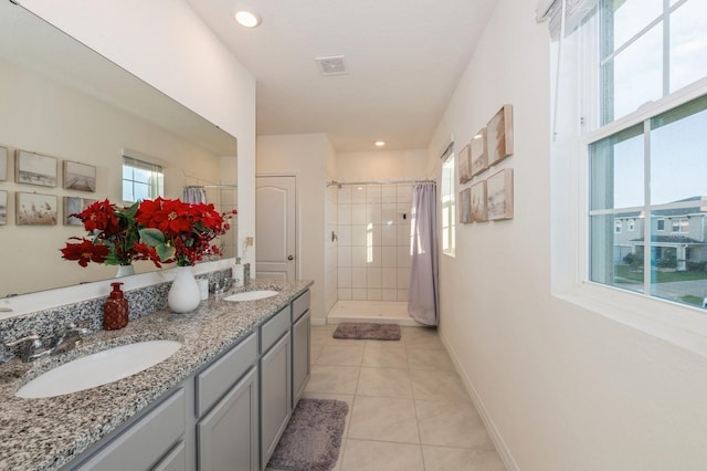 bathroom featuring tile patterned flooring, vanity, and a shower with shower curtain