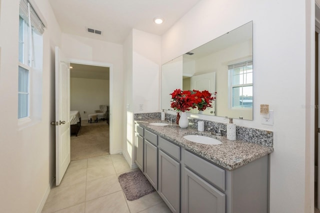 bathroom with tile patterned flooring and vanity