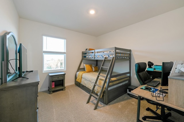 bedroom featuring light carpet