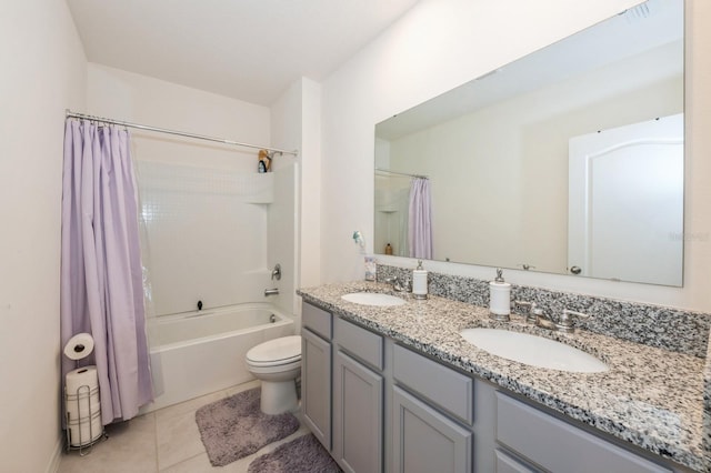 full bathroom featuring tile patterned floors, vanity, toilet, and shower / tub combo with curtain