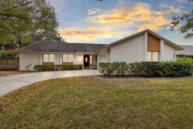 single story home featuring a yard