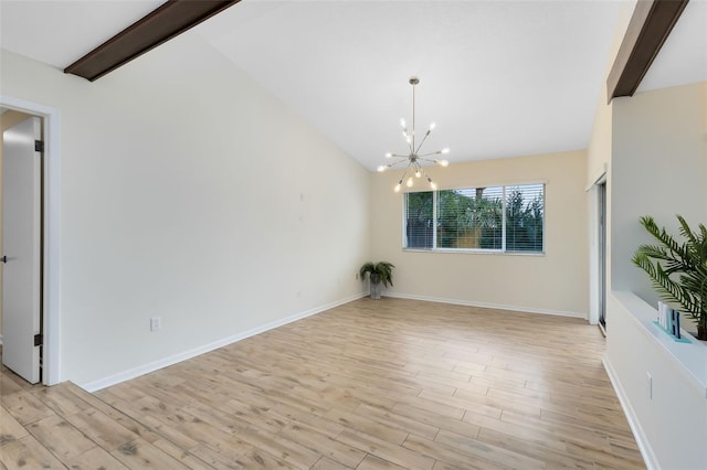 interior space with light hardwood / wood-style flooring, vaulted ceiling with beams, and an inviting chandelier