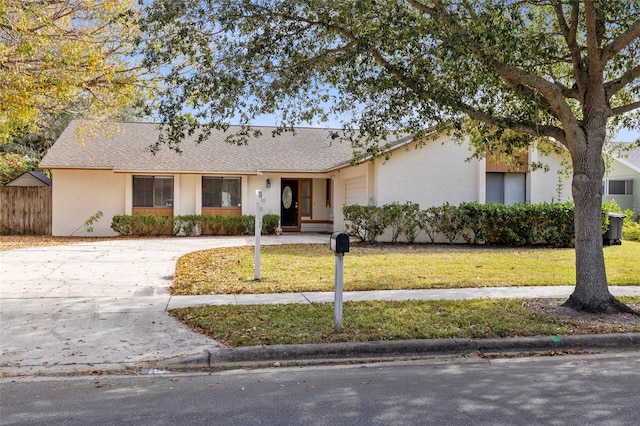 ranch-style house featuring a front lawn