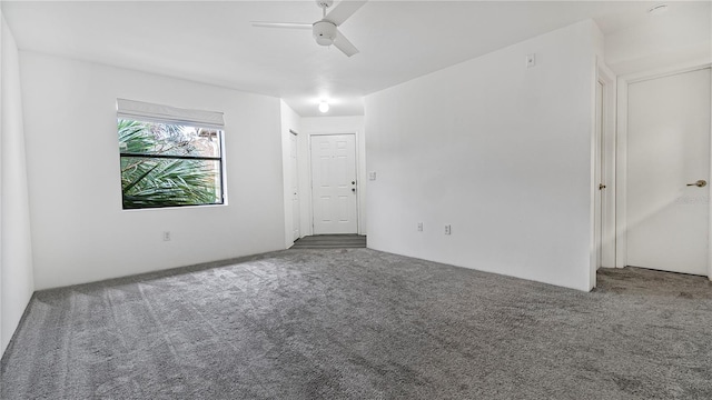 unfurnished room featuring carpet and ceiling fan