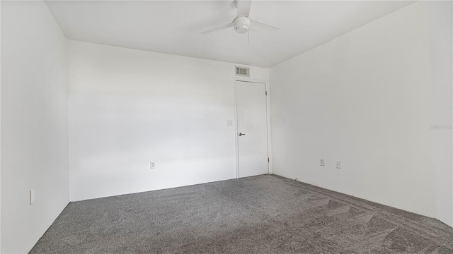 carpeted empty room featuring ceiling fan