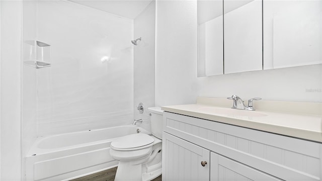 full bathroom with bathtub / shower combination, wood-type flooring, vanity, and toilet