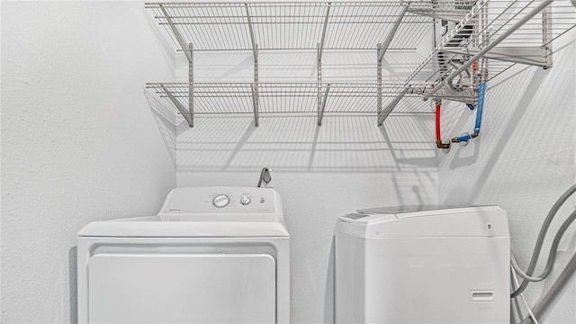 laundry area with washer and clothes dryer