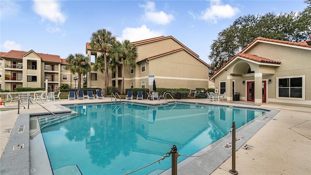 view of swimming pool featuring a patio