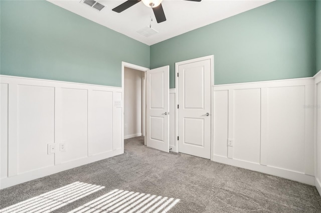 unfurnished bedroom featuring carpet flooring and ceiling fan