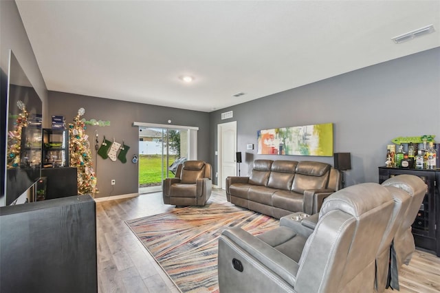 living room with light hardwood / wood-style floors