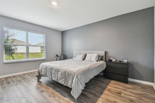 bedroom with hardwood / wood-style floors