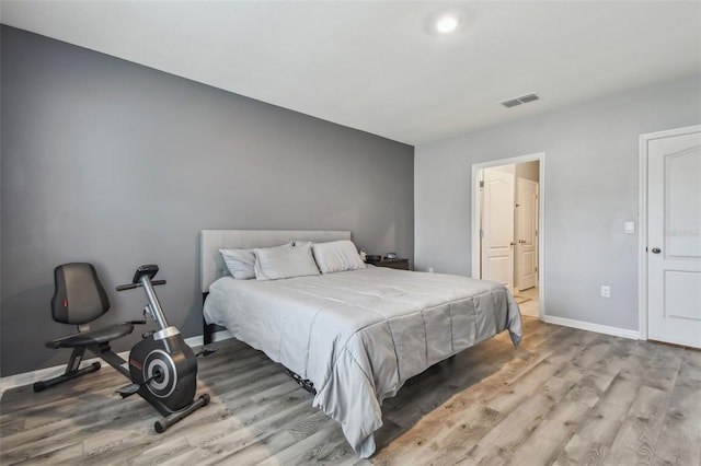 bedroom with light wood-type flooring