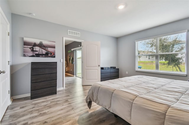 bedroom featuring light hardwood / wood-style floors