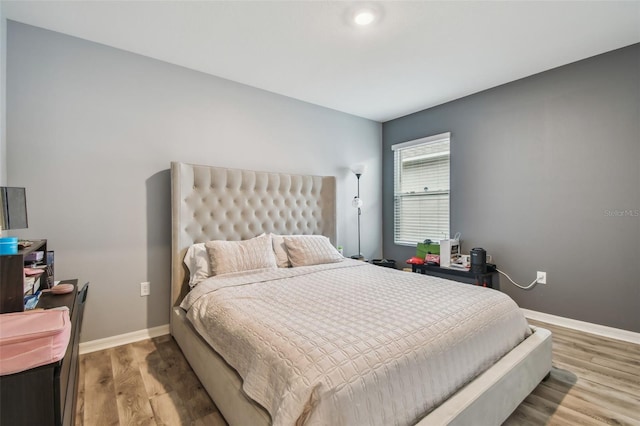 bedroom featuring hardwood / wood-style floors