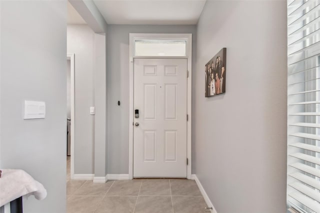 entryway with light tile patterned floors