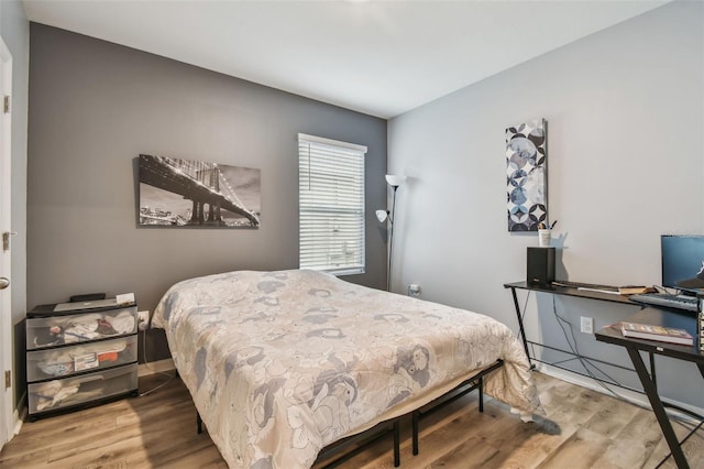 bedroom with wood-type flooring