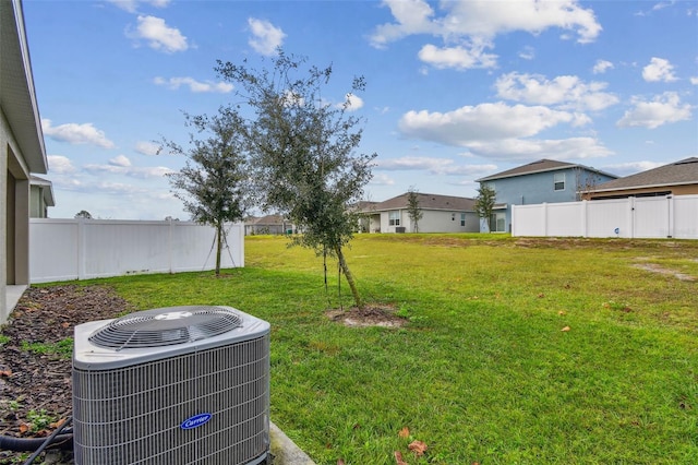 view of yard with central AC unit