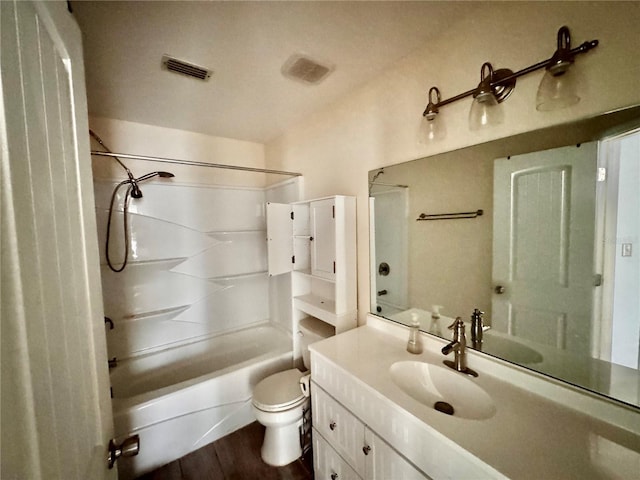 full bathroom featuring wood-type flooring, vanity, toilet, and tub / shower combination