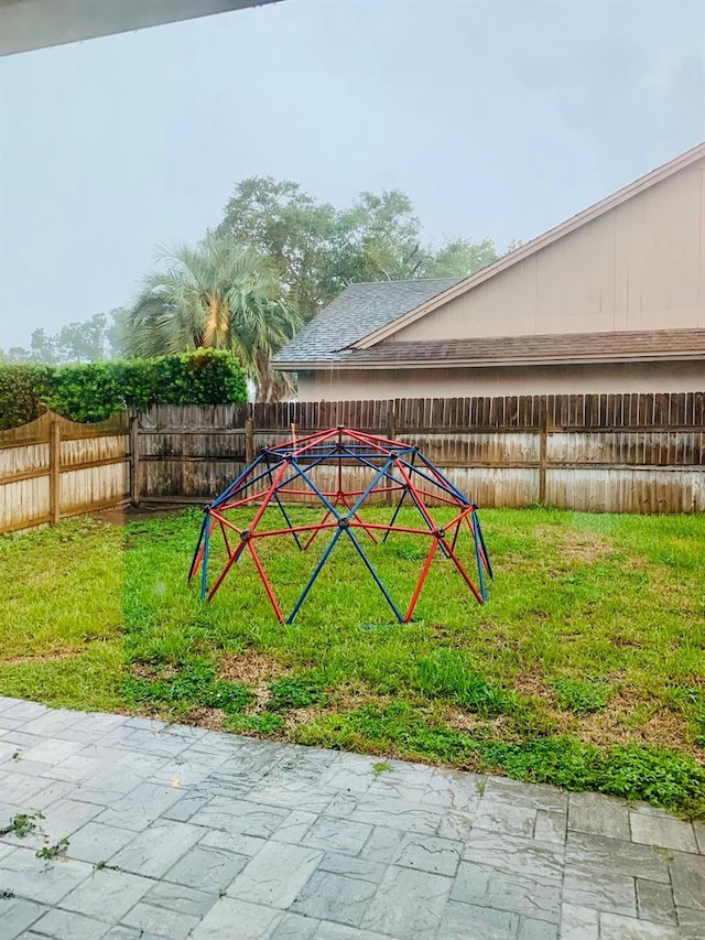 view of play area featuring a lawn