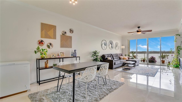 living area featuring light tile patterned floors, ceiling fan, and crown molding