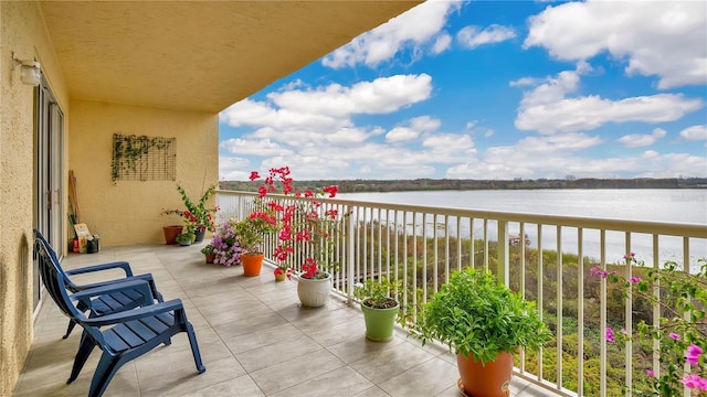 balcony featuring a water view