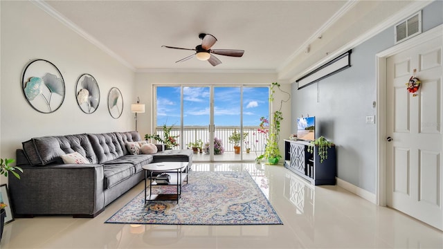 living area with visible vents, ornamental molding, a ceiling fan, light tile patterned flooring, and baseboards