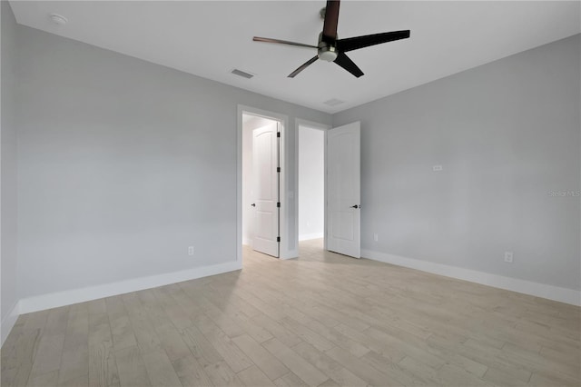 spare room featuring ceiling fan and light hardwood / wood-style flooring