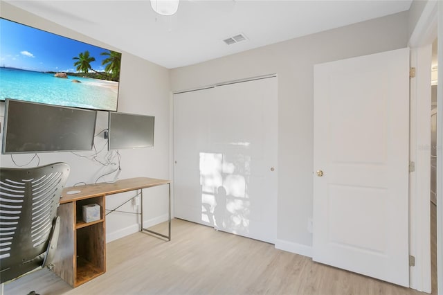 unfurnished office featuring light hardwood / wood-style floors