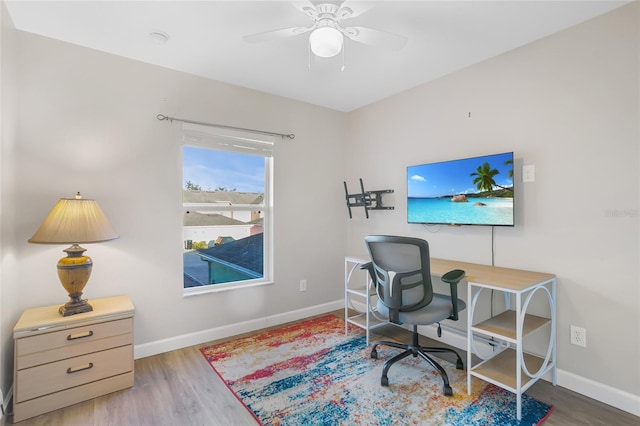 office space featuring light wood-type flooring and ceiling fan