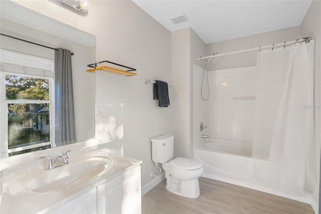 full bathroom featuring toilet, vanity, shower / bath combination with curtain, and hardwood / wood-style flooring