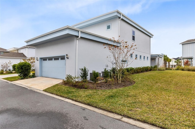 view of property exterior featuring a yard and a garage