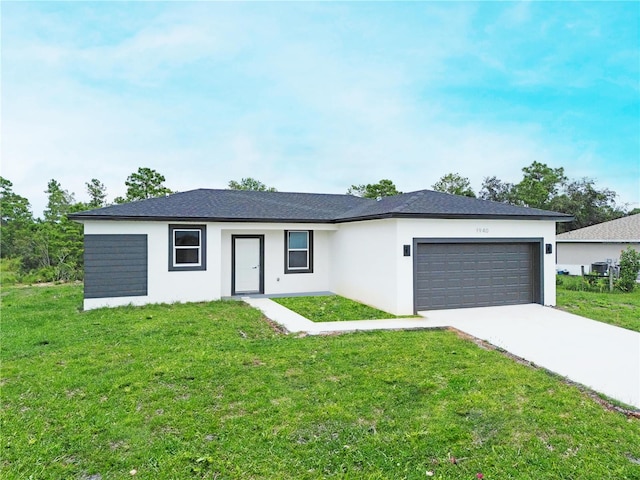 ranch-style house with a front yard and a garage