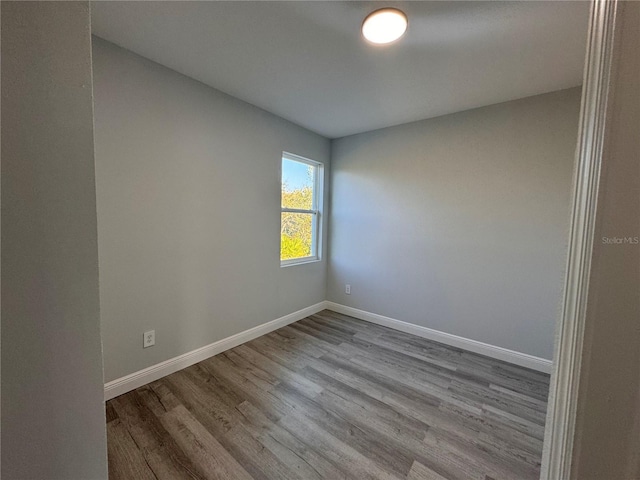 spare room featuring light wood-type flooring