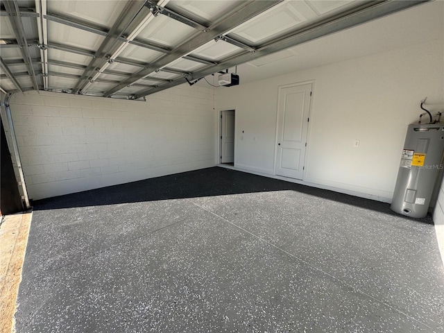 garage featuring electric water heater and a garage door opener