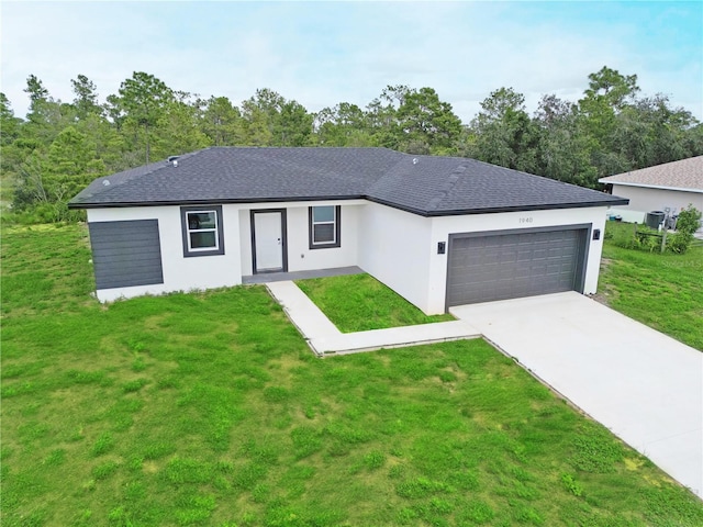 ranch-style home with a garage and a front yard