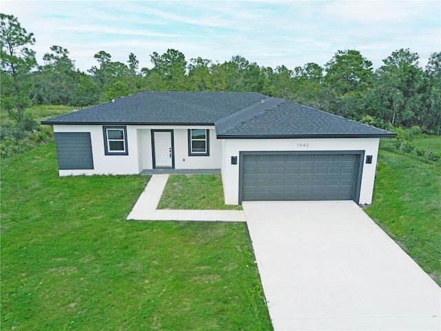 ranch-style home featuring a front yard and a garage