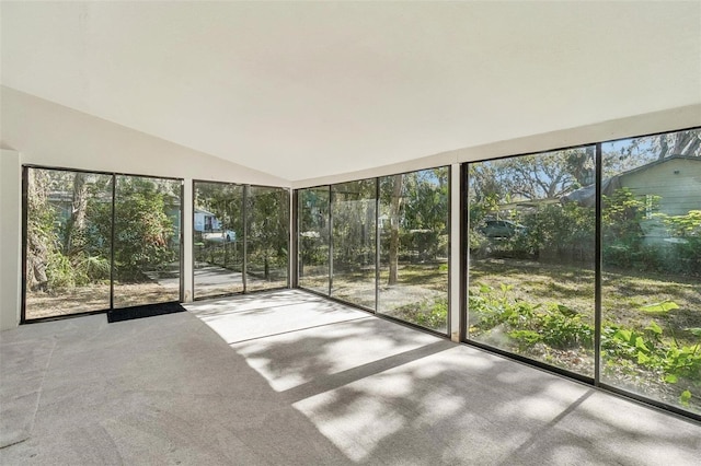 unfurnished sunroom with lofted ceiling and a healthy amount of sunlight