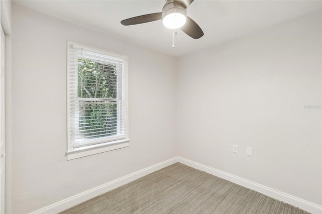 carpeted empty room with ceiling fan