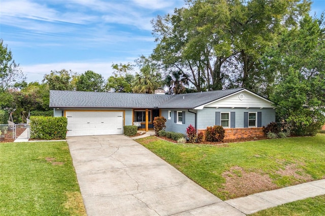 single story home with a front yard and a garage