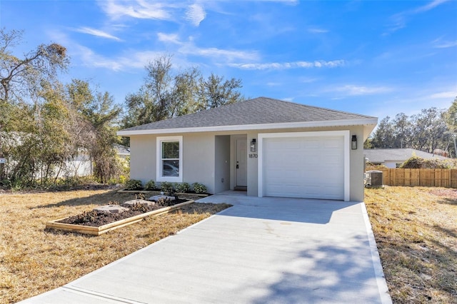 view of front of house featuring central AC and a garage