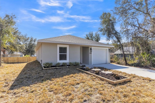 view of front facade with a garage and a front lawn