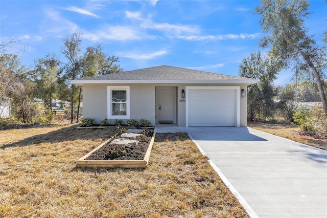 ranch-style home featuring a garage and a front yard