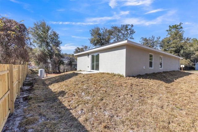 view of side of home featuring a yard