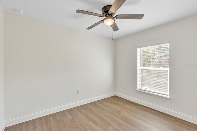 empty room featuring ceiling fan and light hardwood / wood-style flooring